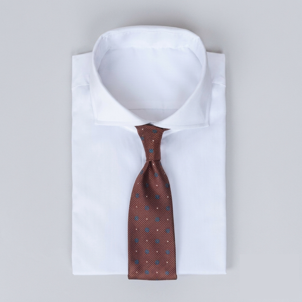 Rich russet/reddish-brown men's necktie with navy blue & white polka dots